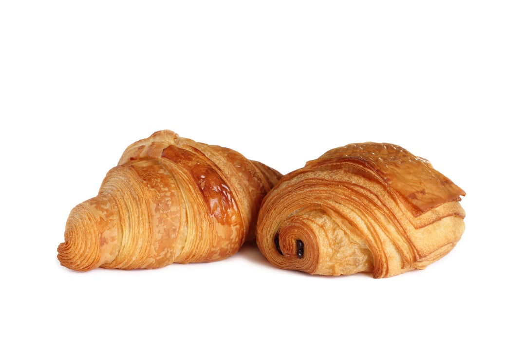 French croissant and petit pain au chocolat on white background.